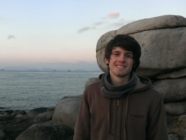 A picture of me during my study abroad. I am standing in front of the Three Giant Stones, five massive boulders that form a megalith in Matsuyama City, Japan